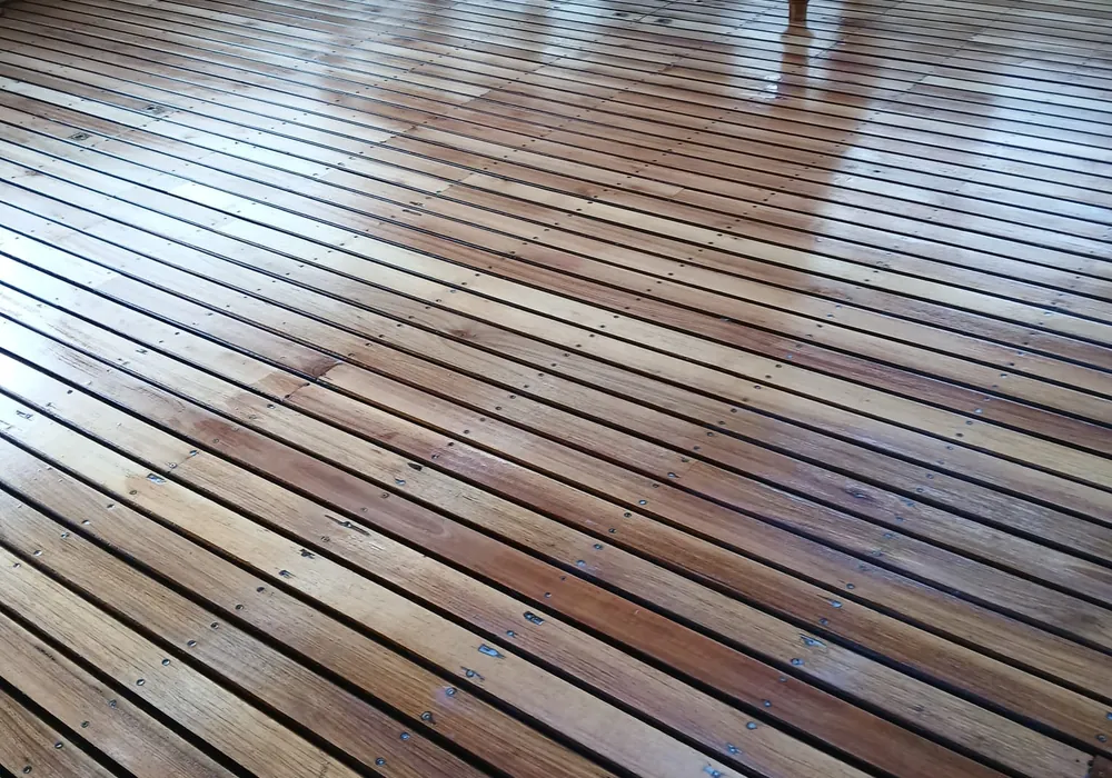 Close view of hardwood deck boards showing grain, spacing and fixings