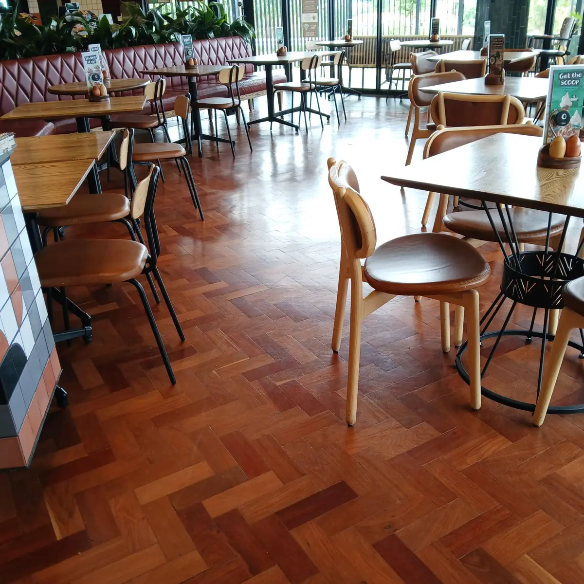 Herringbone parquet wooden flooring in a Sandton restaurant supplied and installed by Impi Teak