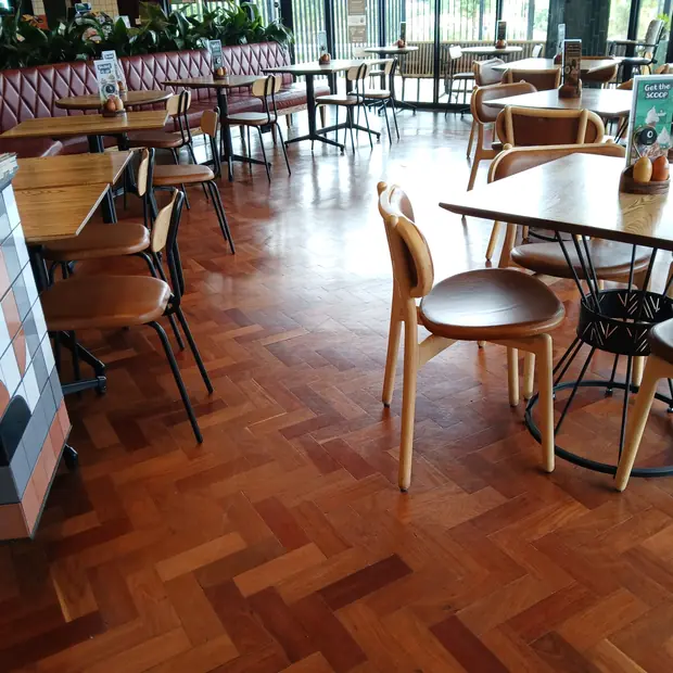 Herringbone parquet wooden flooring in a Sandton restaurant supplied and installed by Impi Teak