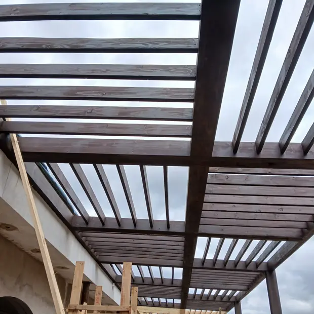 Hardwood pergola beams and slats under construction in Centurion by Impi Teak