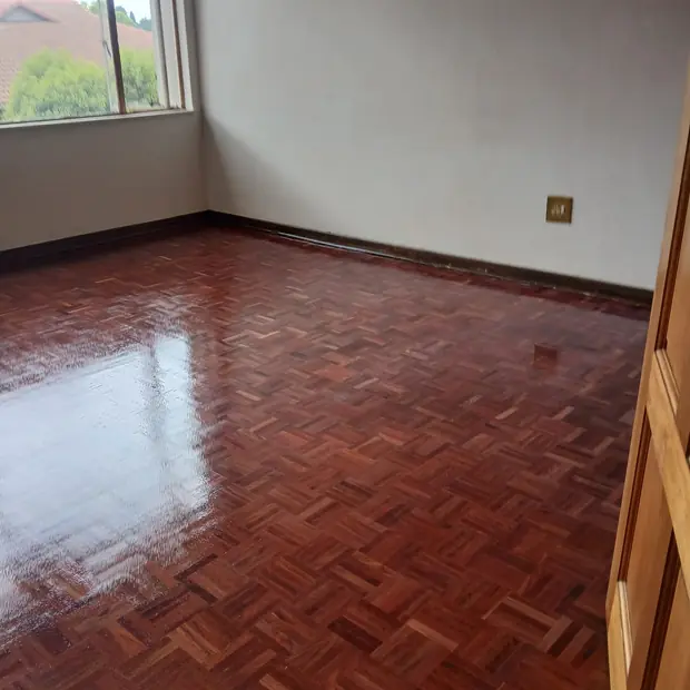 Restored parquet flooring in a Randburg bedroom by Impi Teak