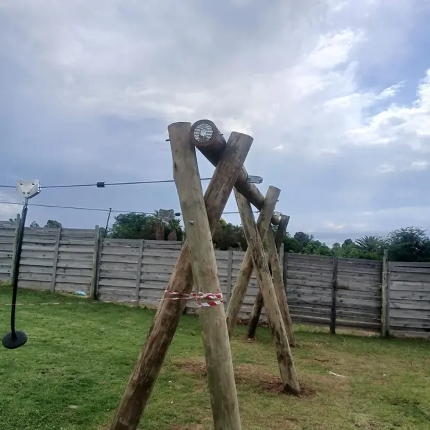 Heavy timber pole structure erected in a Gauteng garden by Impi Teak