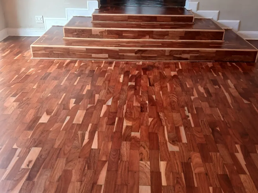 Solid hardwood strip flooring with timber steps laid by Impi Teak in Gauteng